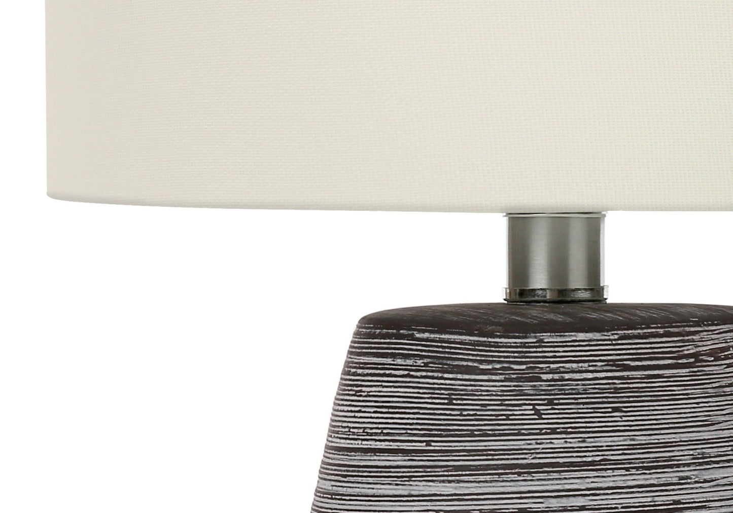 Contemporary table lamp with cream fabric shade, metal neck, and dark distressed wood base on Tampa Home & Garden Store