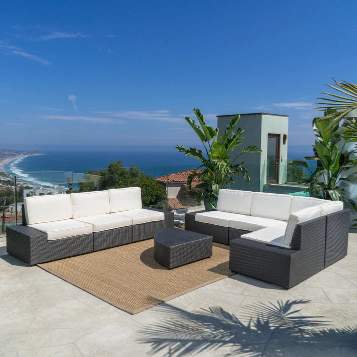 Santa Cruz 8-piece outdoor sectional in dark brown wicker with white cushions on a patio on Tampa Home & Garden Store