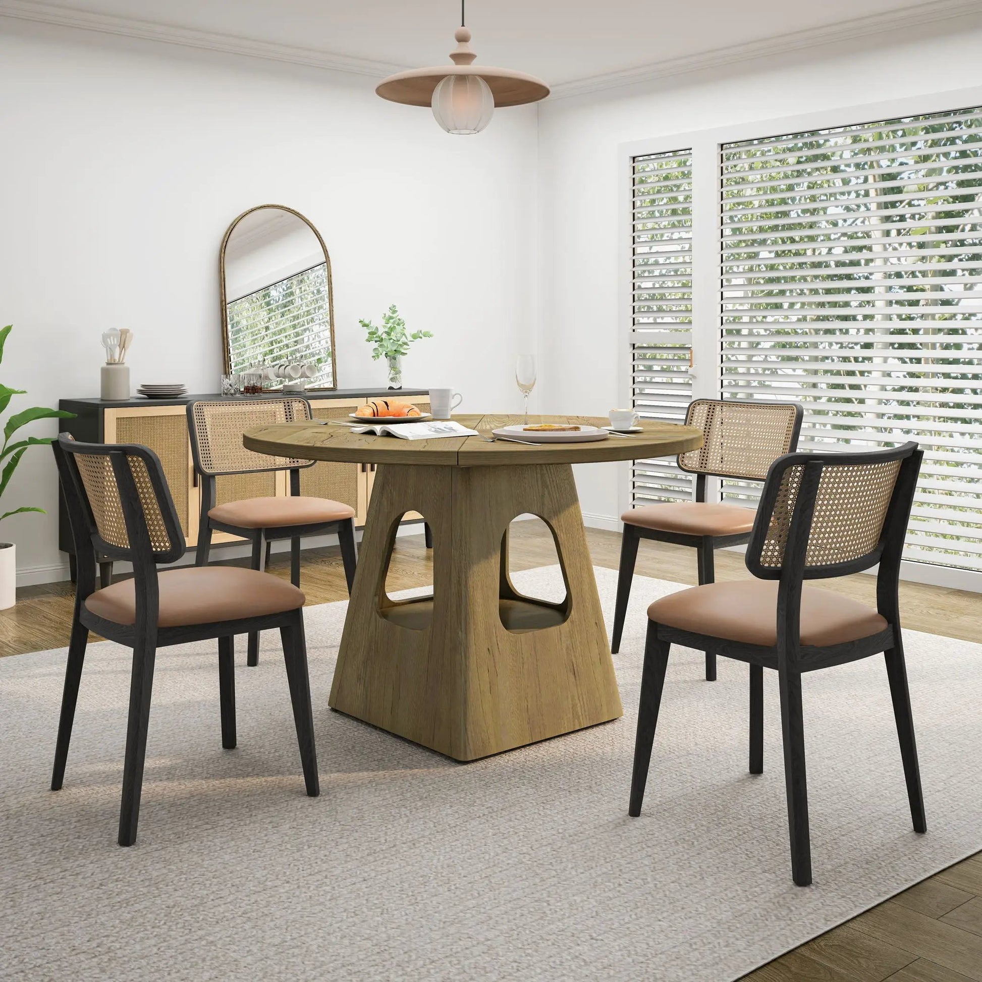 Farmhouse round dining table with storage base in wood, surrounded by six black cane chairs on Tampa Home & Garden Store