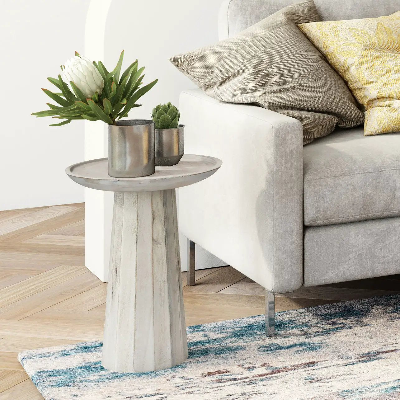 Dayton handcrafted wooden accent table with weathered base beside gray sofa on Tampa Home & Garden Store