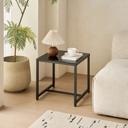 Table For Living Room coffee table with black metal frame and glass top in a living room on Tampa Home & Garden Store