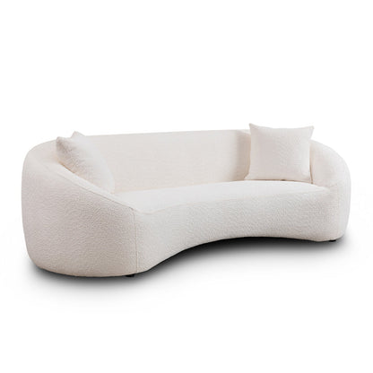 Minimalist curved 3-seater sofa in cream boucle upholstery with two textured cushions on Tampa Home & Garden Store