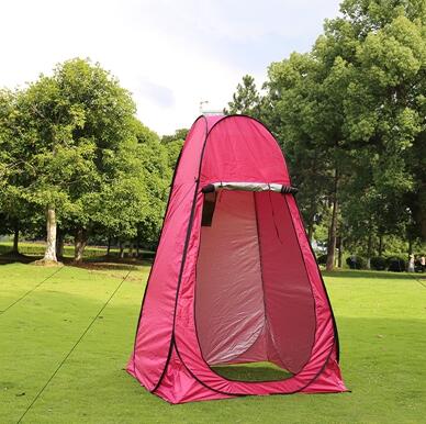 Portable privacy tent for camping in bright pink, open-front UV sun shelter on grassy park on Tampa Home & Garden Store