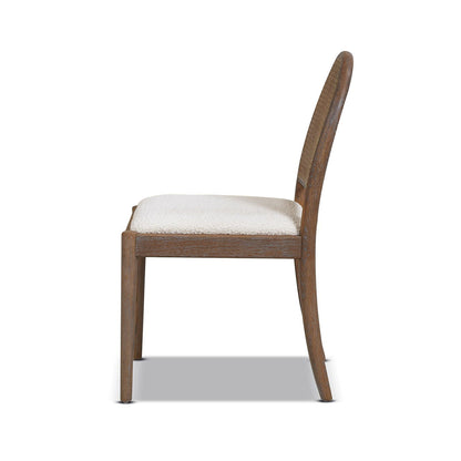Curved cane dining chair with brown wood frame, beige upholstered seat, cane-inspired back on Tampa Home & Garden Store