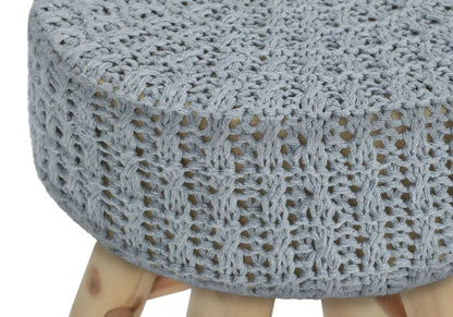 Round knitted ottoman pouf with light gray crochet weave and natural wood legs on Tampa Home & Garden Store