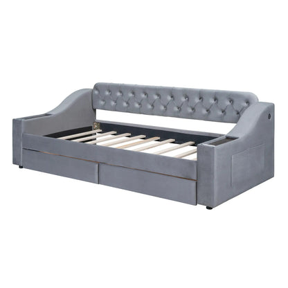 Upholstered grey daybed with tufted back and storage armrests, wooden slat base on Tampa Home & Garden Store