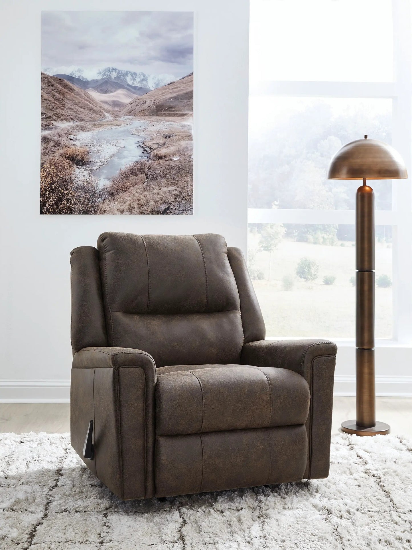 Lixtowel Rocker Recliner in brown leather upholstery with plush padded arms on Tampa Home & Garden Store