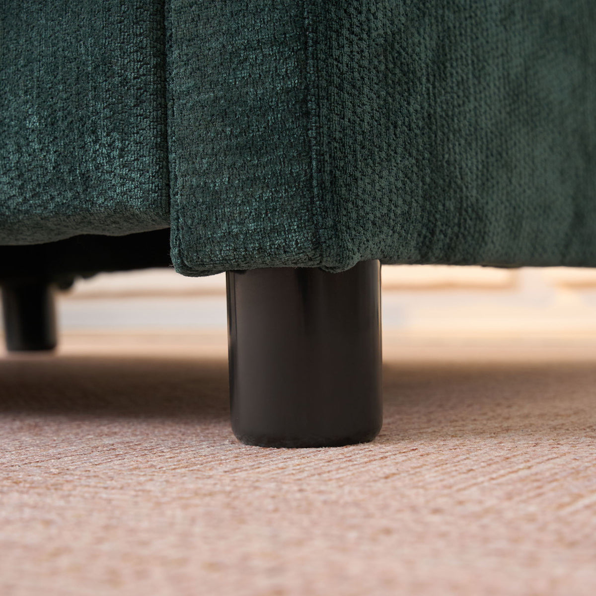 Modern Reading Armchair close-up in dark teal textured fabric with black metal leg on carpet on Tampa Home & Garden Store