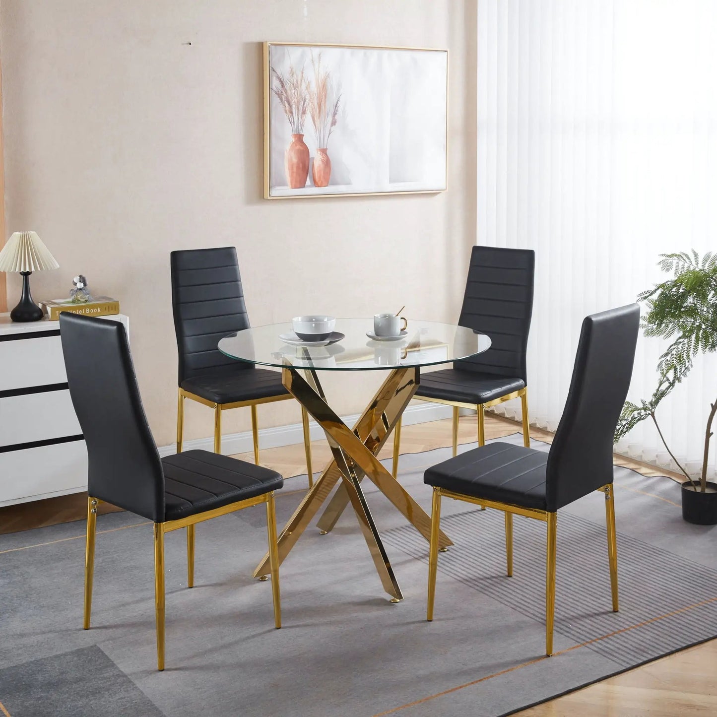 Elegant Legs Dining Chair set of 4 black faux-leather seats with gold legs around a glass dining table on Tampa Home & Garden Store