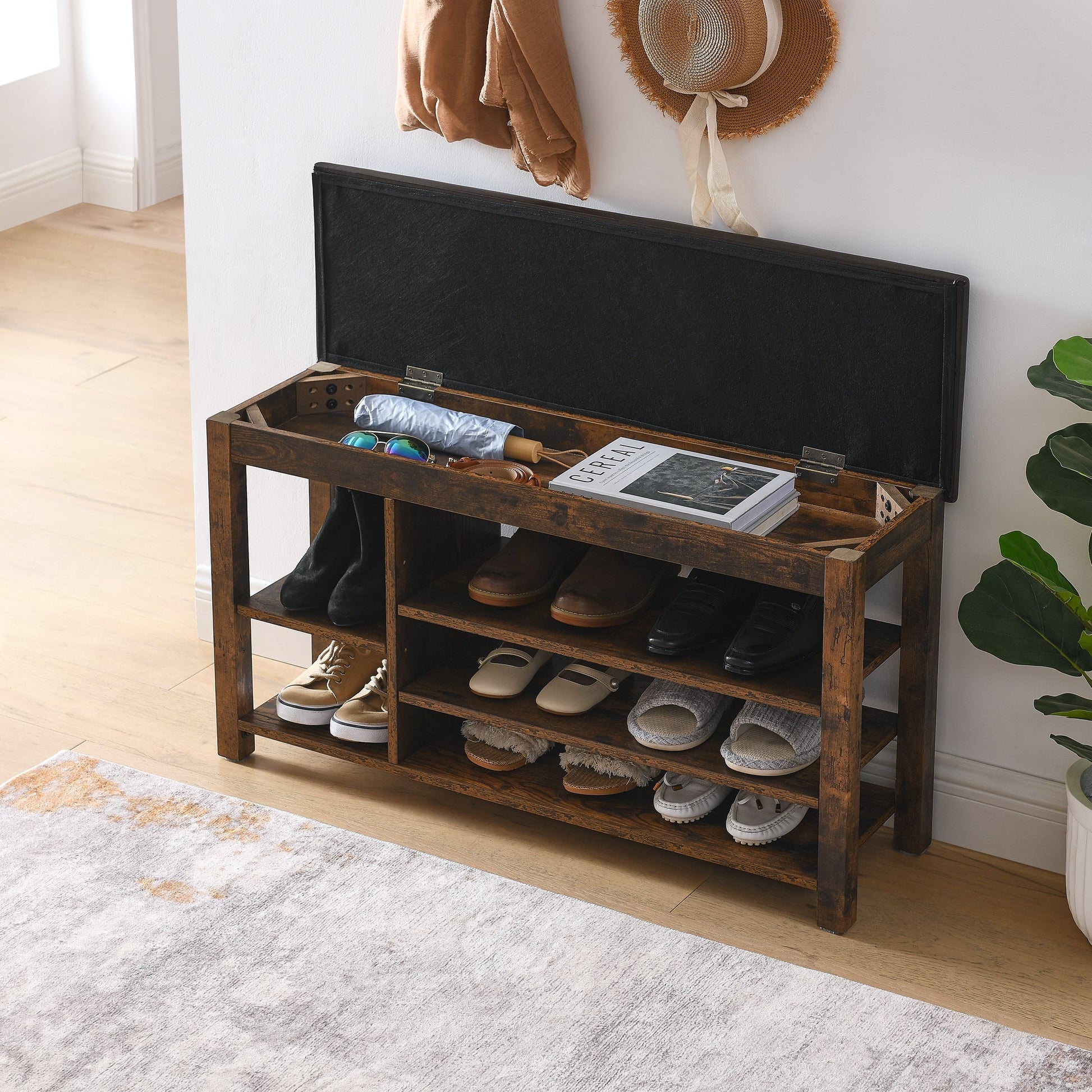 Height-Adjustable shoe bench with dark wood frame and black lid, open cubbies with shoes on Tampa Home & Garden Store
