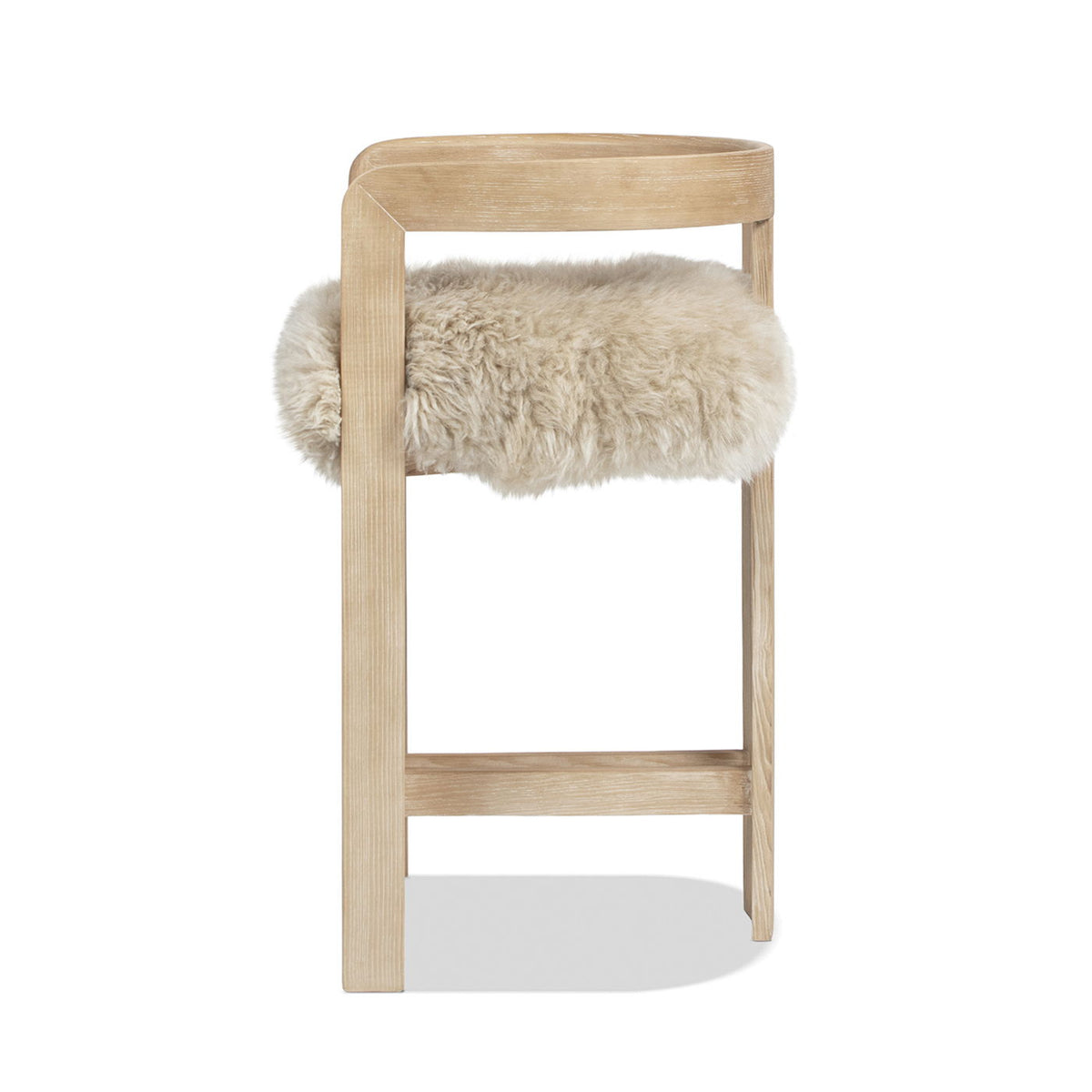 Low back counter stool with a sheepskin fur seat in light wood frame HouseOfZazla on Tampa Home & Garden Store