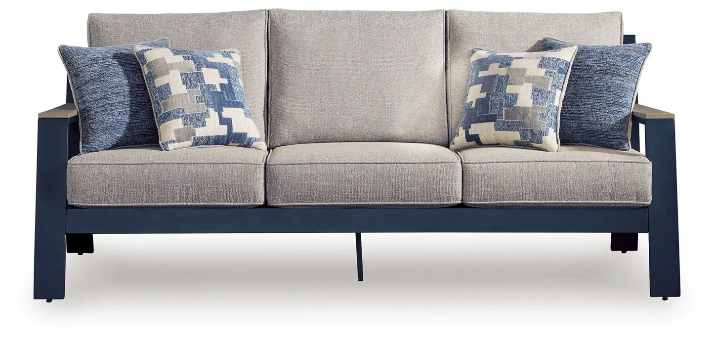 East Beach blue sofa with three seat cushions and geometric-pattern throw pillows on a navy frame on Tampa Home & Garden Store