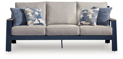 East Beach blue sofa with three seat cushions and geometric-pattern throw pillows on a navy frame on Tampa Home & Garden Store