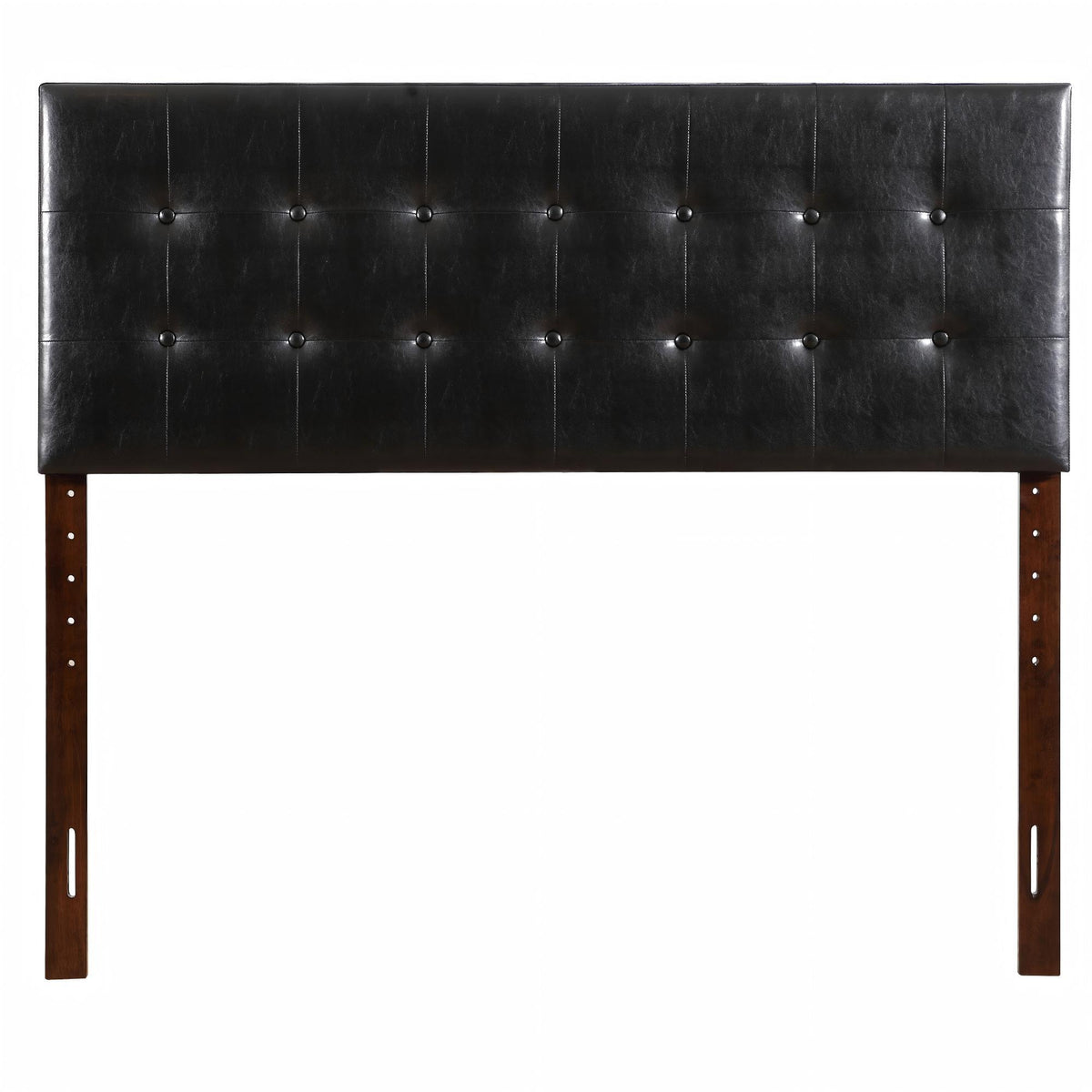 Black upholstered headboard with button-tufted panels and wooden legs on Tampa Home & Garden Store