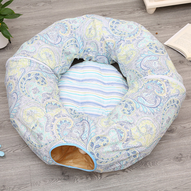 Cat tunnel sleeping nest donut bed in pastel paisley fabric with blue trim and striped cushion on Tampa Home & Garden Store