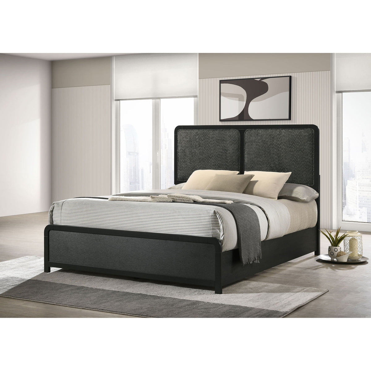 Burton bed with upholstered headboard in dark gray, panel bed frame with striped bedding on Tampa Home & Garden Store