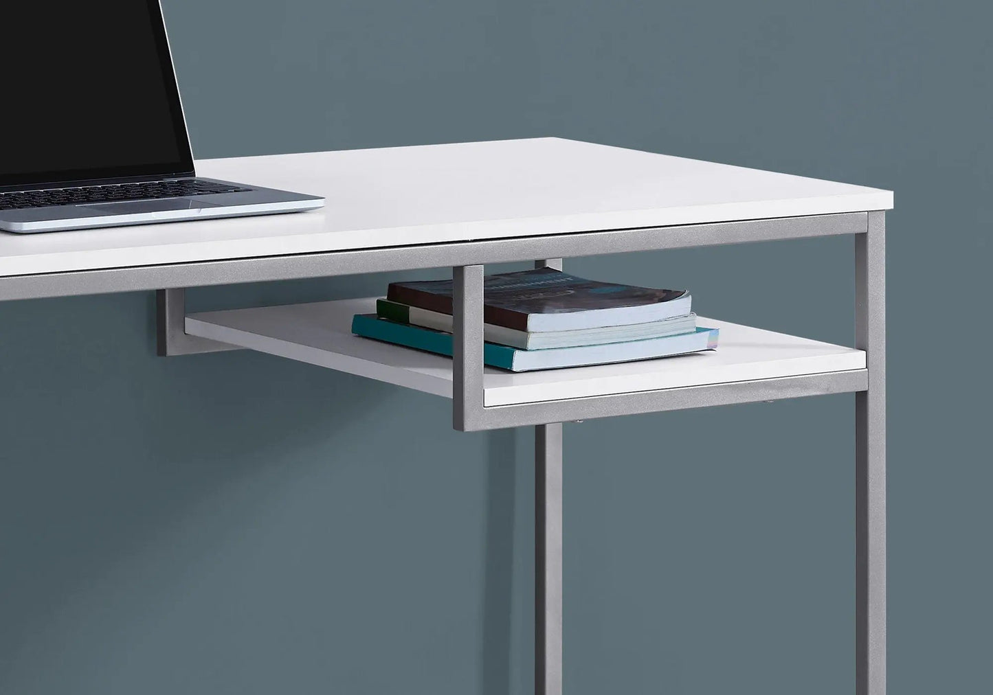 Computer desk white top with metal frame by Unique Piece Furniture; laptop on desk, books on shelf on Tampa Home & Garden Store