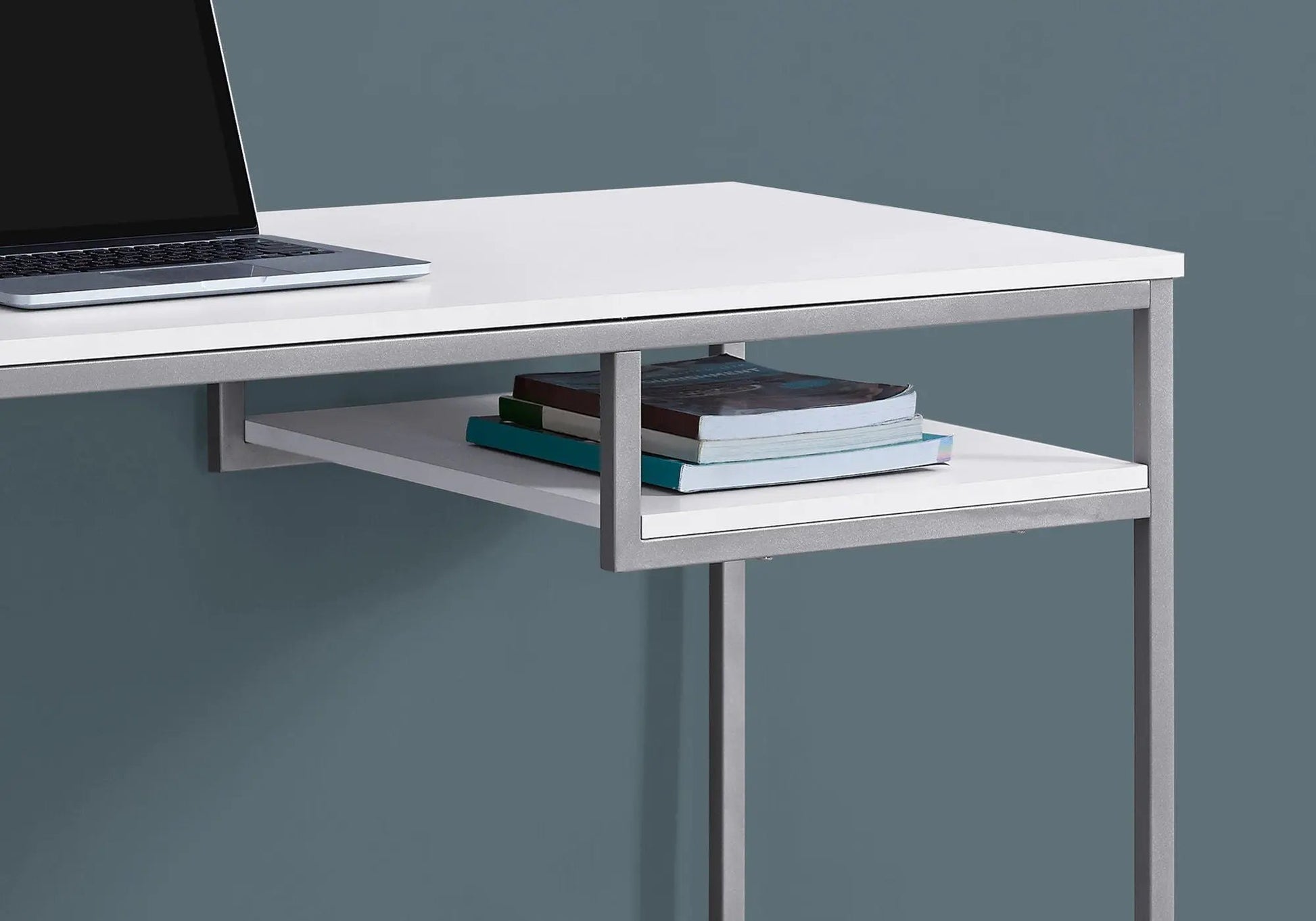 Computer desk white top with metal frame by Unique Piece Furniture; laptop on desk, books on shelf on Tampa Home & Garden Store