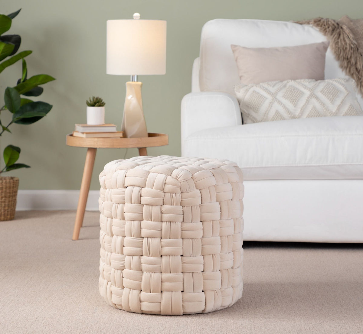 Braided round beige ottoman with chunky woven texture for versatile seating in the living room on Tampa Home & Garden Store