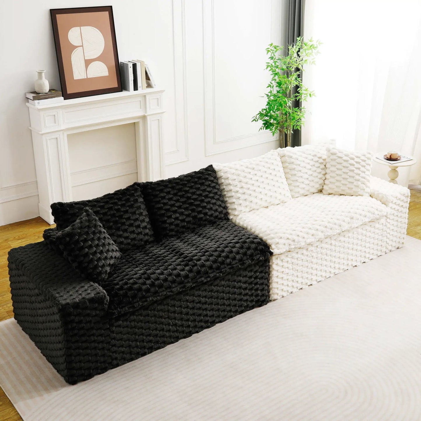 Stationary sofa with two chunky knitted throws in white and black in a bright living room on Tampa Home & Garden Store