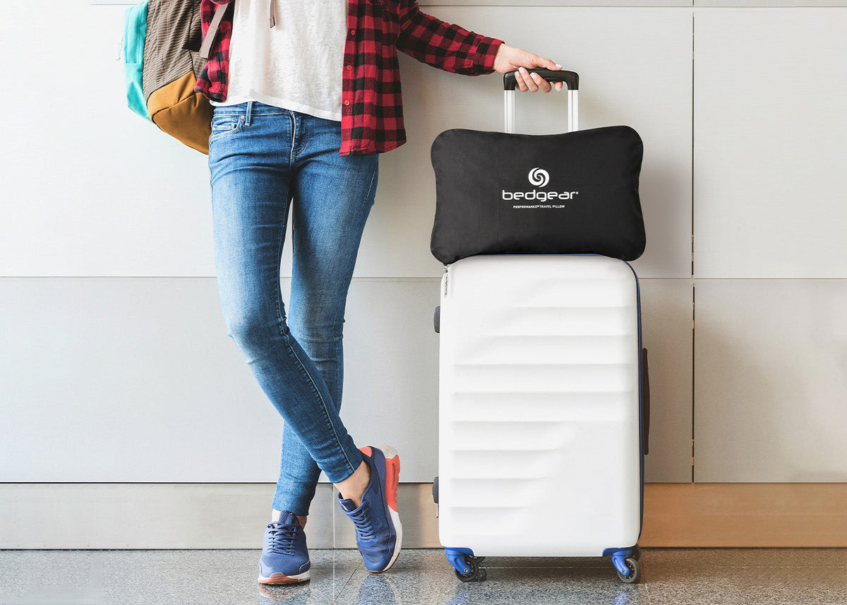 BedGear Storm Rectangle Travel Pillow black with white logo atop a white suitcase on Tampa Home & Garden Store