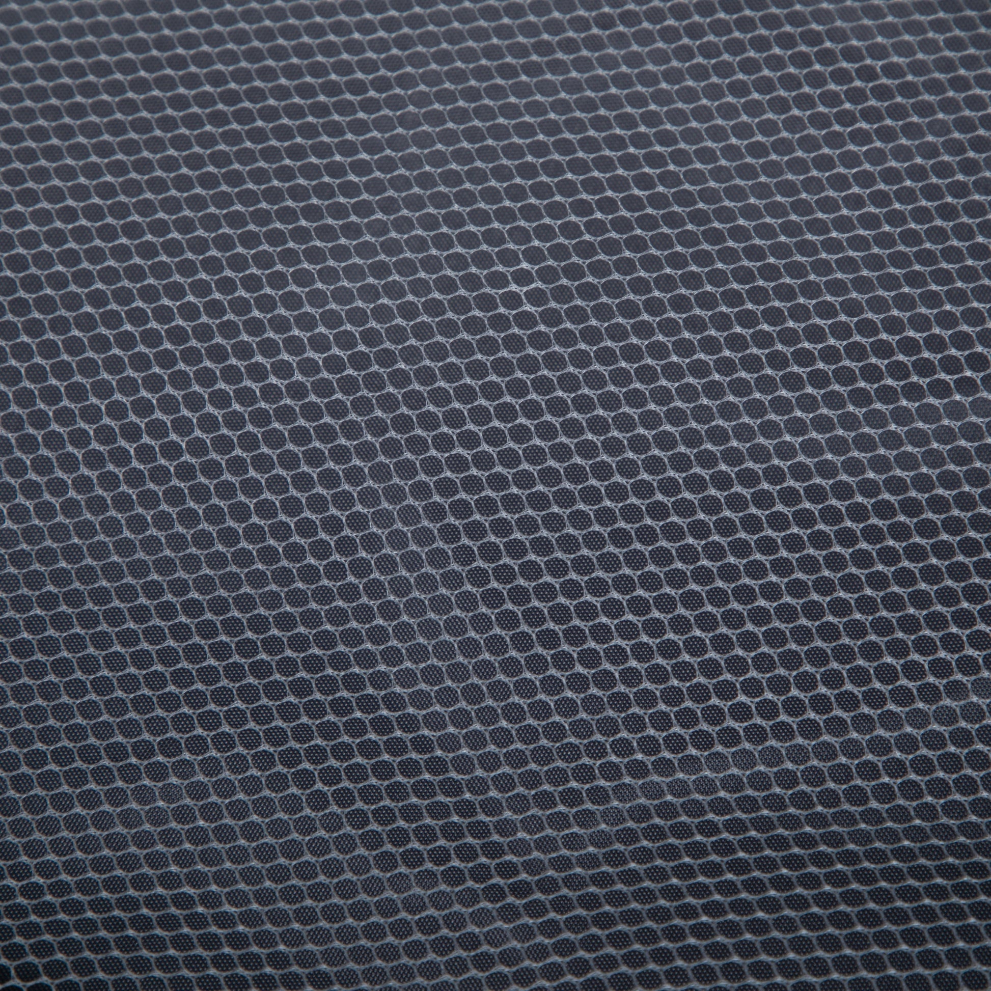 ABS spinner luggage fabric texture close-up with dark gray circular pattern on Tampa Home & Garden Store