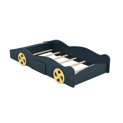 Race car shaped platform bed with yellow wheels and wood slat base, dark navy finish on Tampa Home & Garden Store