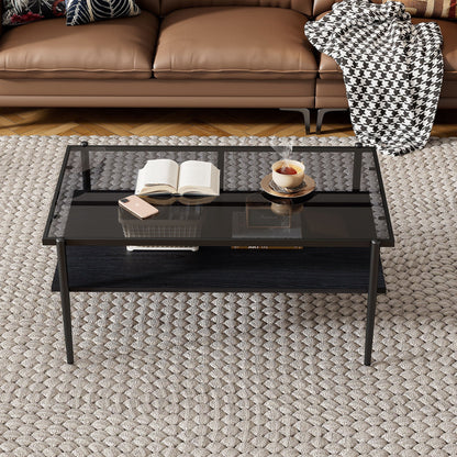 Rectangle coffee table with tempered glass top and black metal legs, books and cup on top on Tampa Home & Garden Store