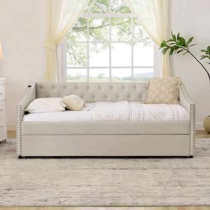 Gray upholstered daybed with tufted back, nailhead trim, and pull-out trundle on Tampa Home & Garden Store