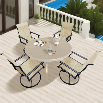 Outdoor patio set for 4 with swivel chairs, beige cushions, round tan table, black frames on Tampa Home & Garden Store