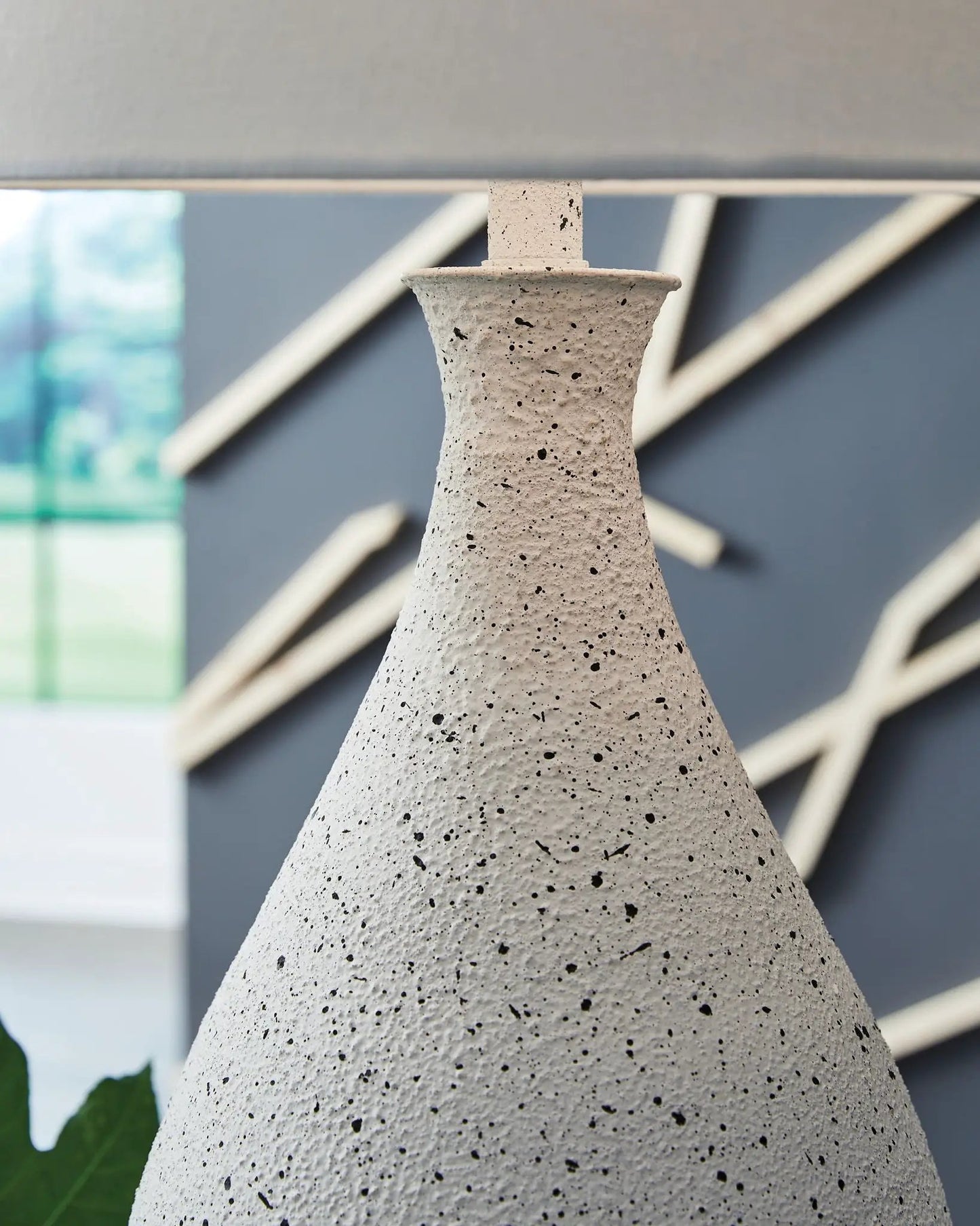 Wyattford metal table lamp with speckled beige base, white/black finish, modern look on Tampa Home & Garden Store