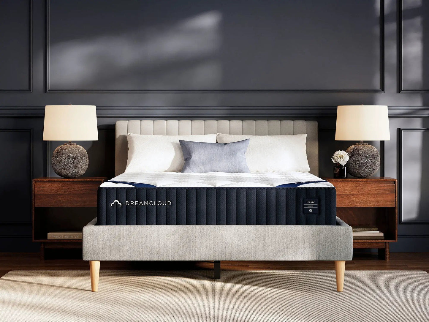 DreamCloud Classic Hybrid mattress by Unique Piece Furniture on beige bed with dark walls on Tampa Home & Garden Store