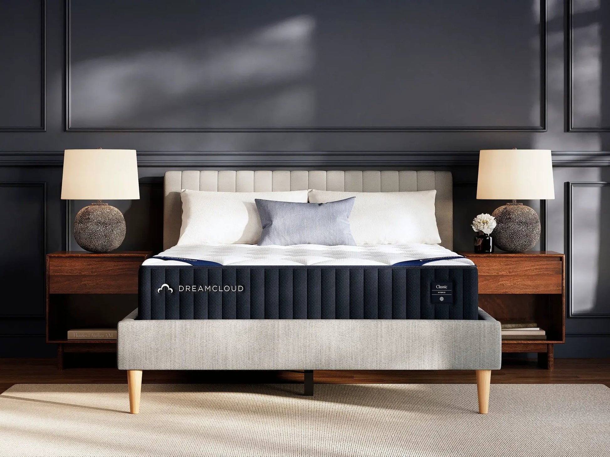 DreamCloud Classic Hybrid mattress by Unique Piece Furniture on beige bed with dark walls on Tampa Home & Garden Store
