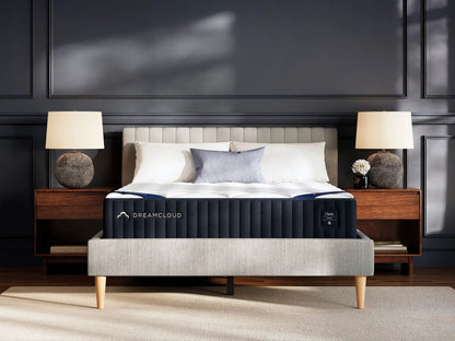 DreamCloud Classic Hybrid mattress by Unique Piece Furniture on beige bed with dark walls on Tampa Home & Garden Store