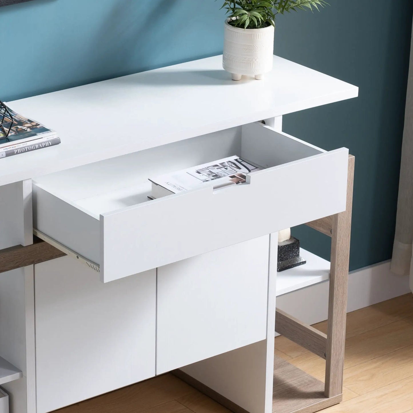Sideboard cabinet in white with four drawers and light wood legs on Tampa Home & Garden Store