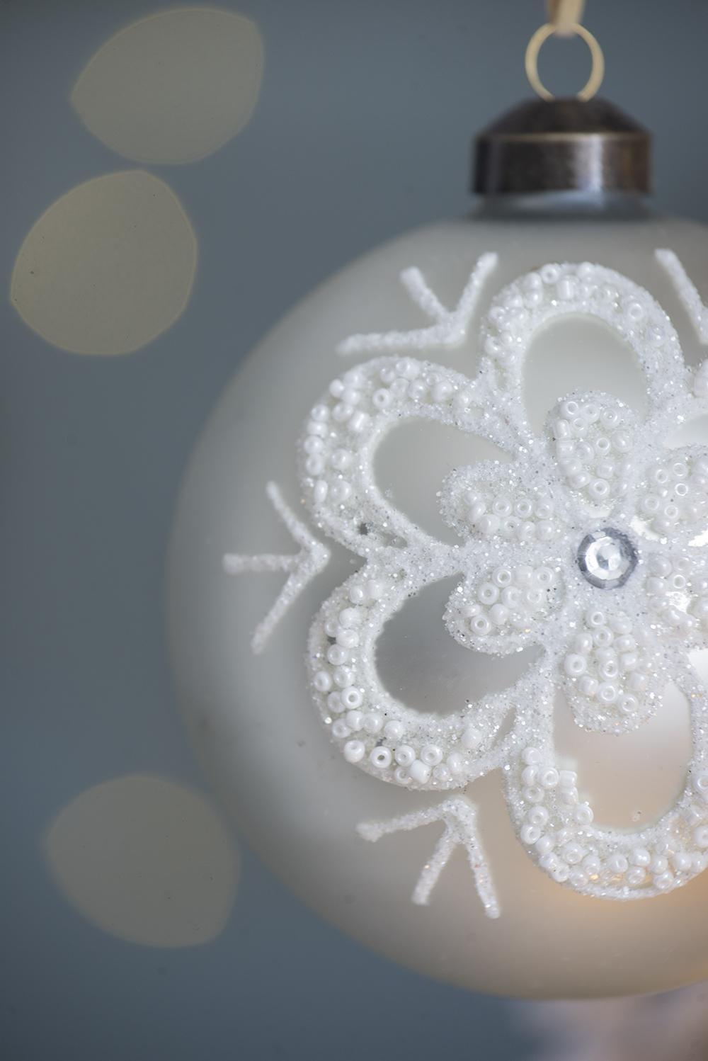 Christmas ball ornament white glass hanging ornament with beaded snowflake design and silver cap on Tampa Home & Garden Store