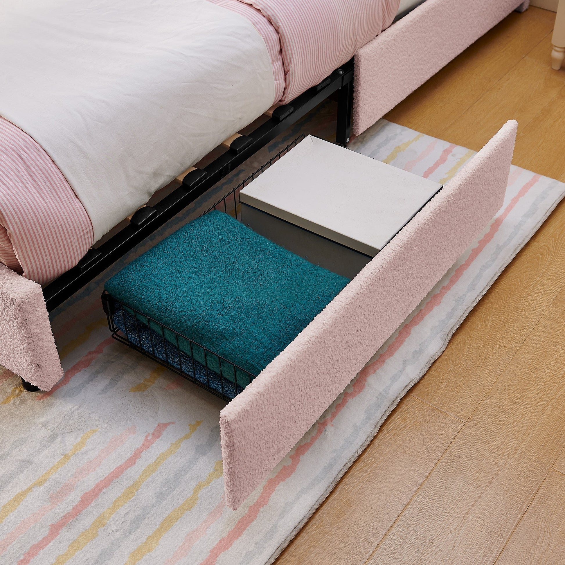 Queen size kids upholstered bed with rabbit ear headboard in pink fabric and under storage on Tampa Home & Garden Store