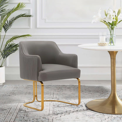 Modern arm chair dark gray upholstery with gold cantilever legs on Tampa Home & Garden Store