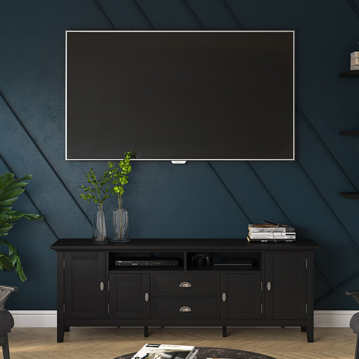Handcrafted media stand with adjustable shelves in black, featuring a Samsung TV and two glass vases on Tampa Home & Garden Store