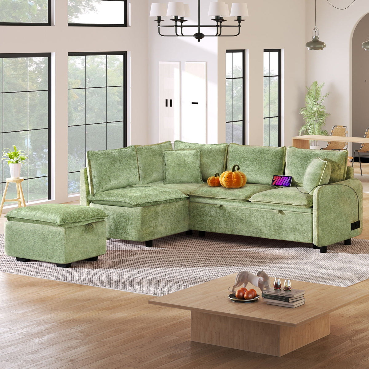 Sleeper sectional sofa in green fabric with storage ottoman and two pillows in living room on Tampa Home & Garden Store
