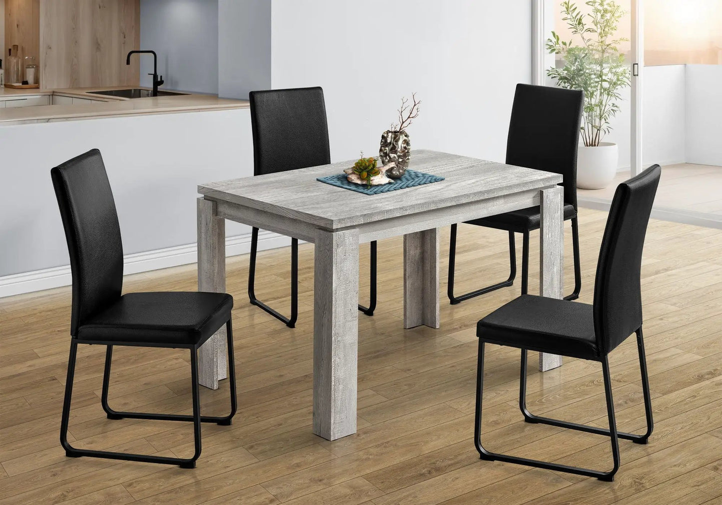 Rectangular dining table in gray wood with black metal legs and leather chairs on Tampa Home & Garden Store