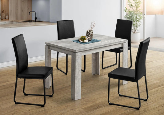 Rectangular dining table in gray wood with black metal legs and leather chairs on Tampa Home & Garden Store