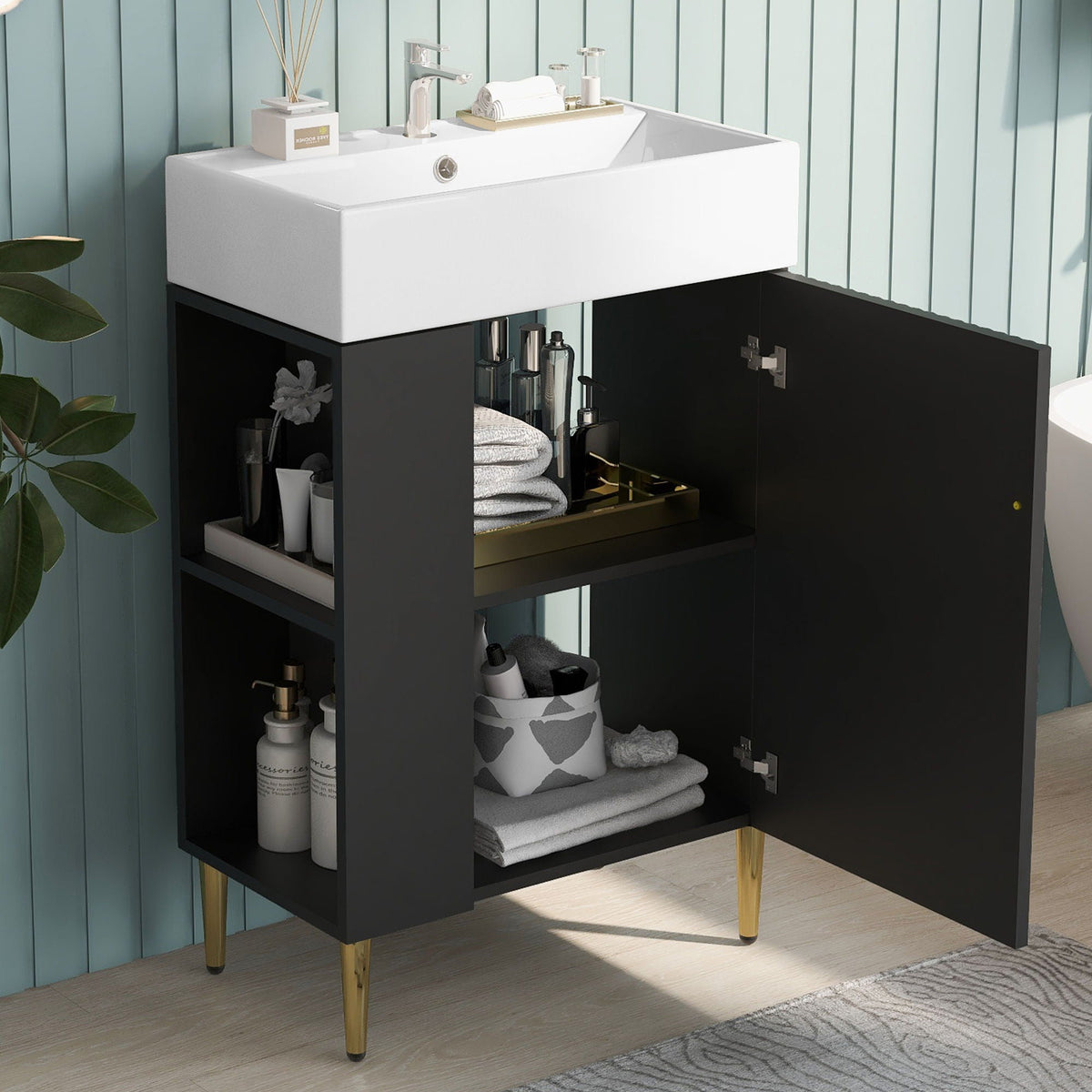 Bathroom vanity with ceramic sink on black cabinet with gold legs; towel storage on Tampa Home & Garden Store