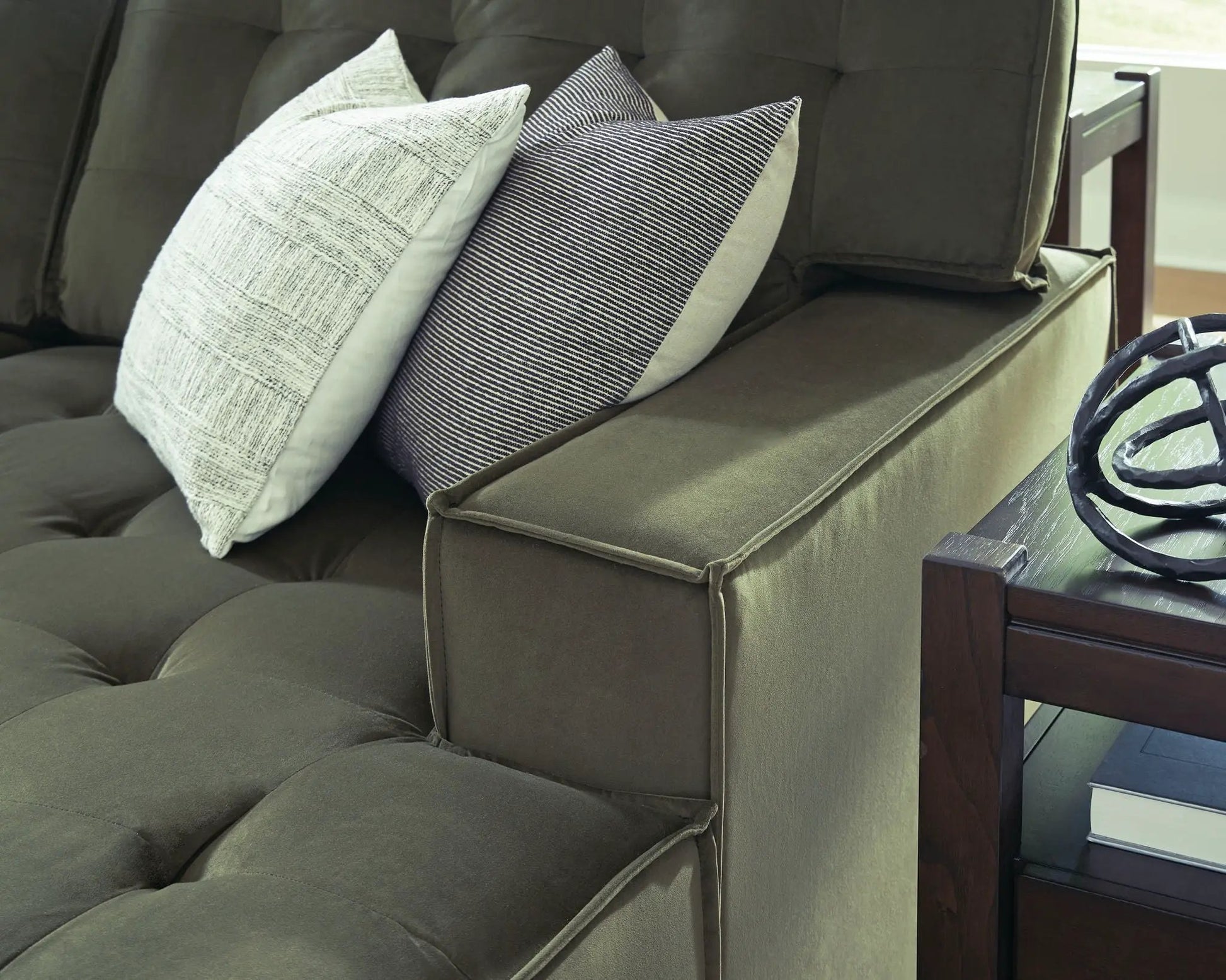 Caspian-Town Sectional stationary in olive-green fabric with two decorative pillows on Tampa Home & Garden Store