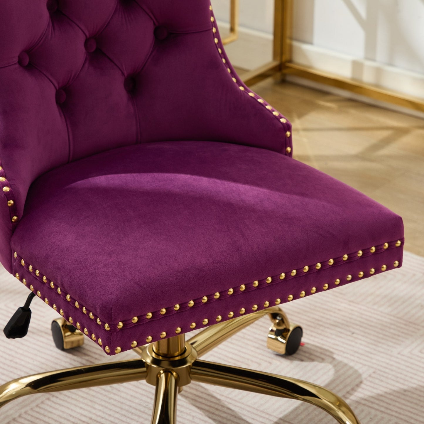 Velvet tufted purple office chair with gold nailhead trim and rolling base on Tampa Home & Garden Store