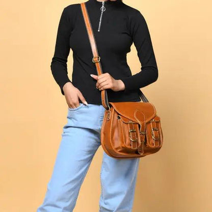 Tan leather sling bag for women with two front pockets and crossbody strap on Tampa Home & Garden Store