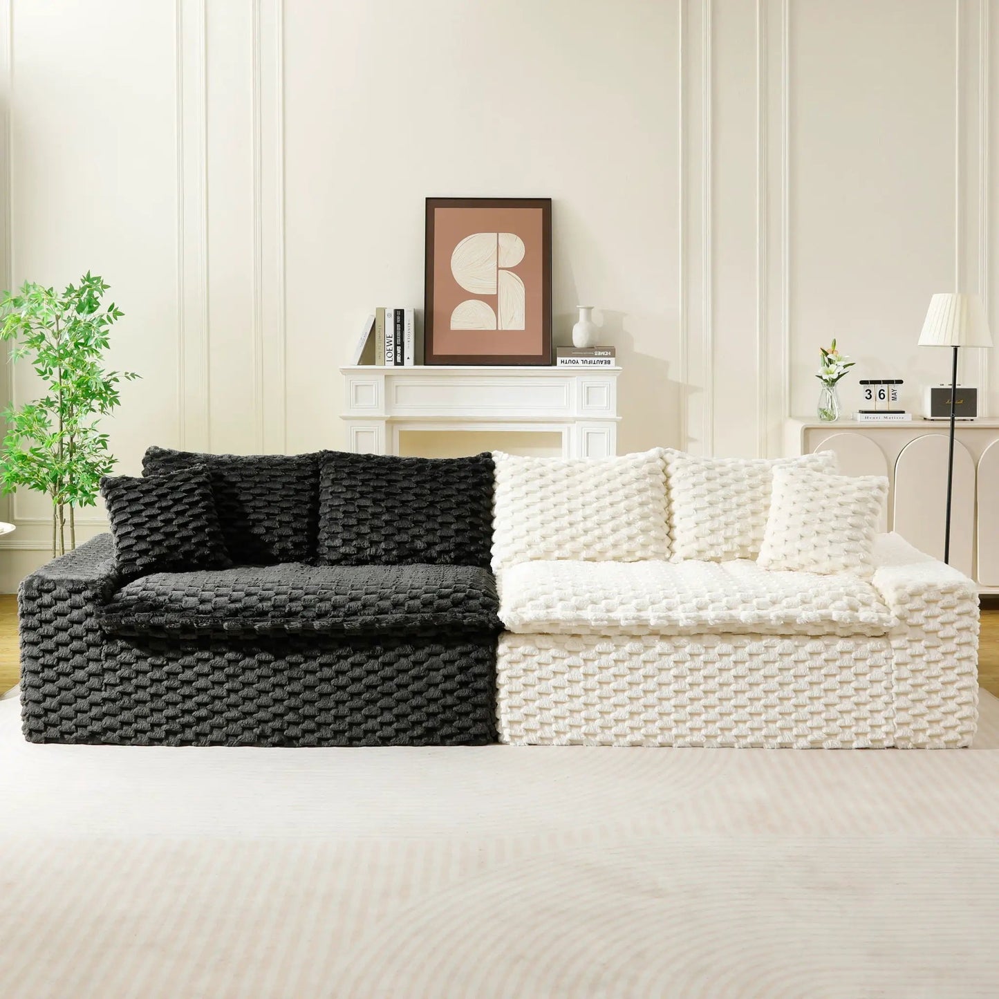 Luxury multifunctional sofa with black and white chunky knit throws in a minimal living room on Tampa Home & Garden Store