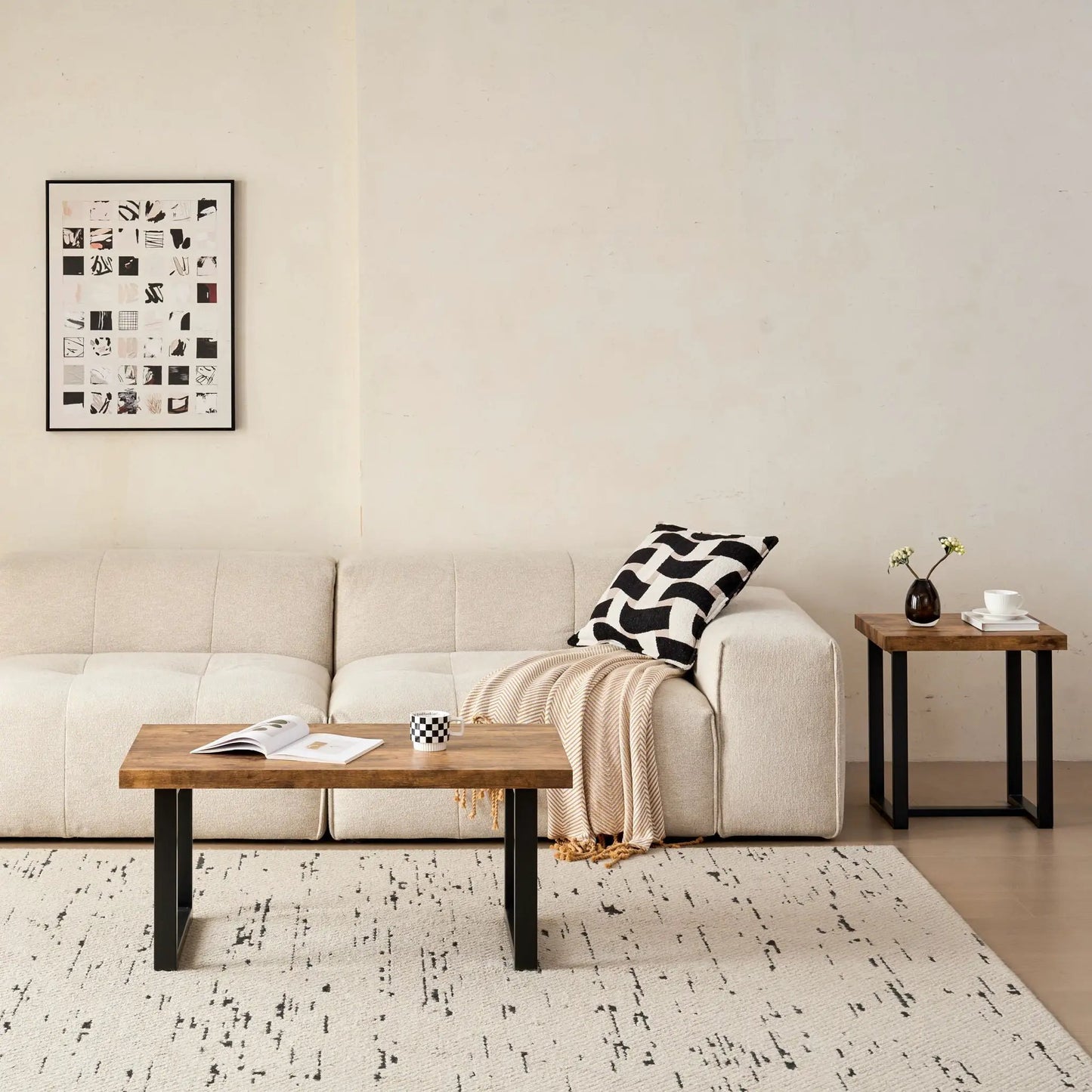 Two coffee tables by Unique Piece Furniture with wood tops and black legs in beige living room on Tampa Home & Garden Store
