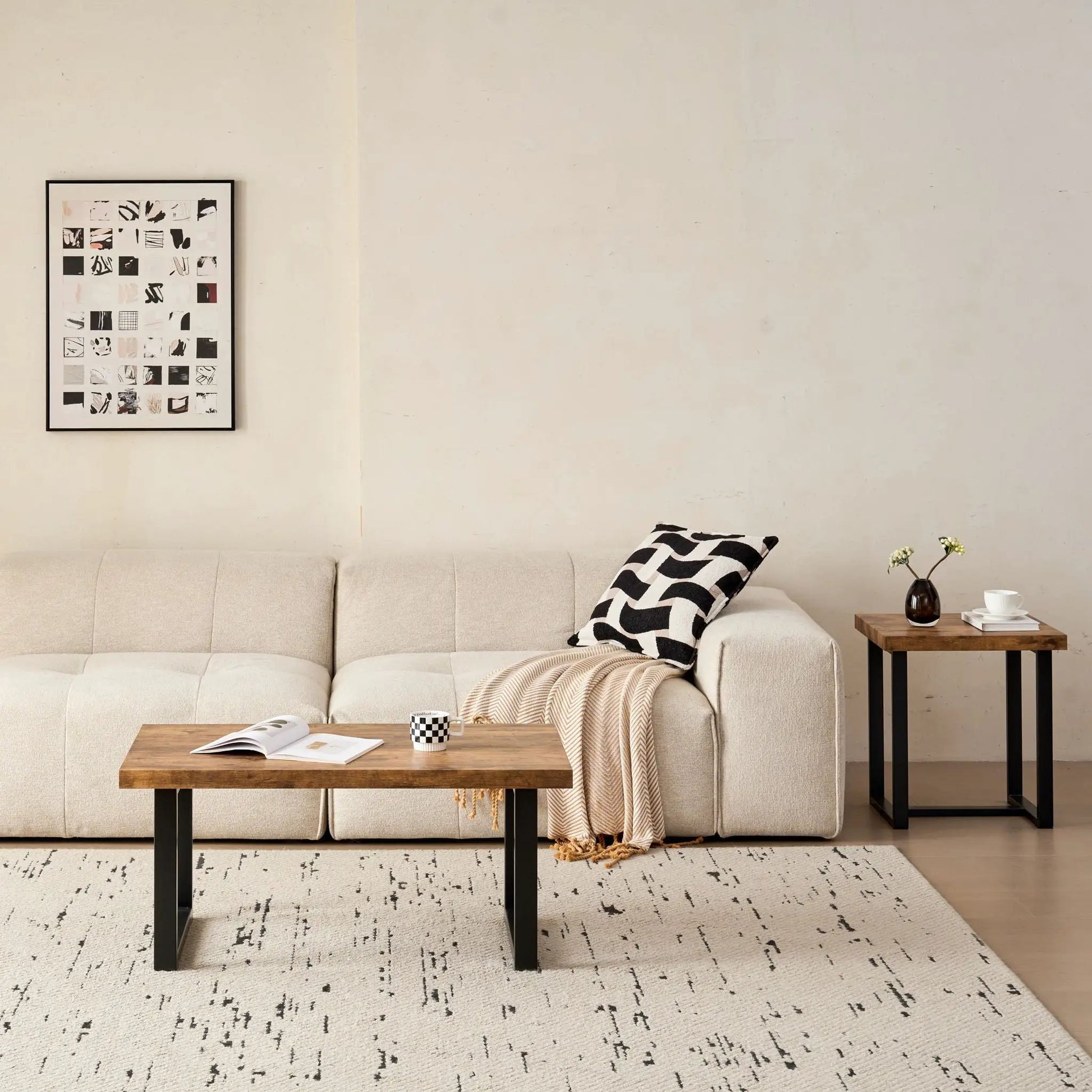 Two coffee tables by Unique Piece Furniture with wood tops and black legs in beige living room on Tampa Home & Garden Store
