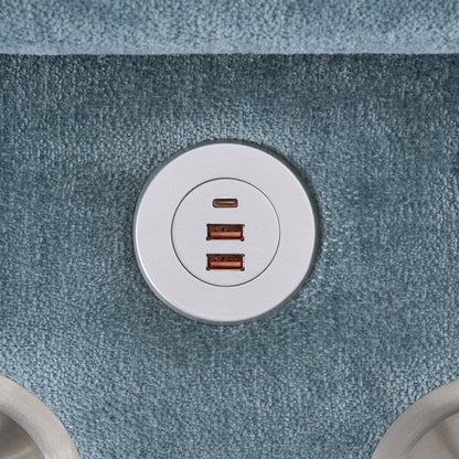 Circular silver metal USB charging hub with multiple ports on blue carpet on Tampa Home & Garden Store